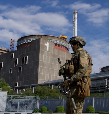 A soldier stands outside Zaporizhzhia nuclear power plant, Ukraine